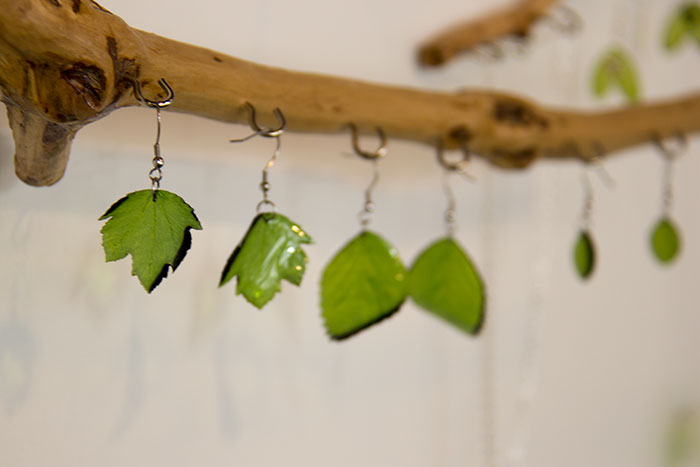 Looking forward to December. Branch with jewellery pieces, display from a fair