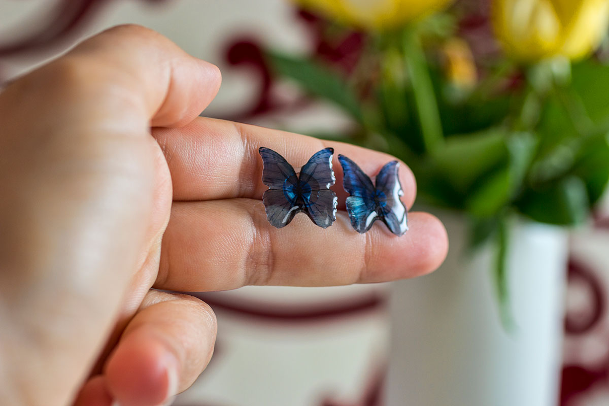 Blue Morpho Butterfly Studs Blue in Hand